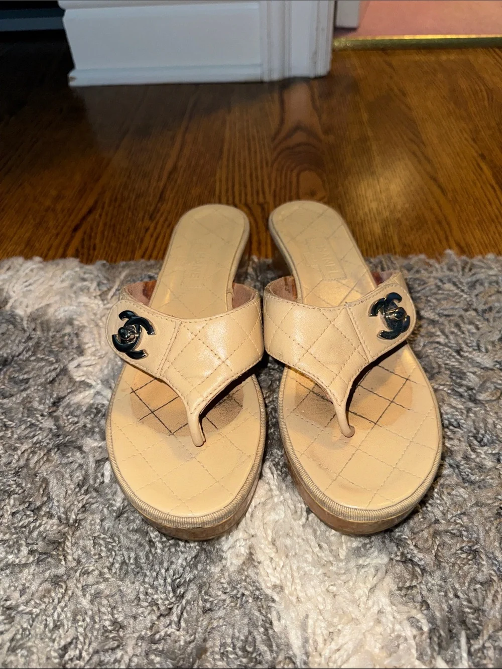 CHANEL Cream Quilted Leather Slide Mules with Logo Accent